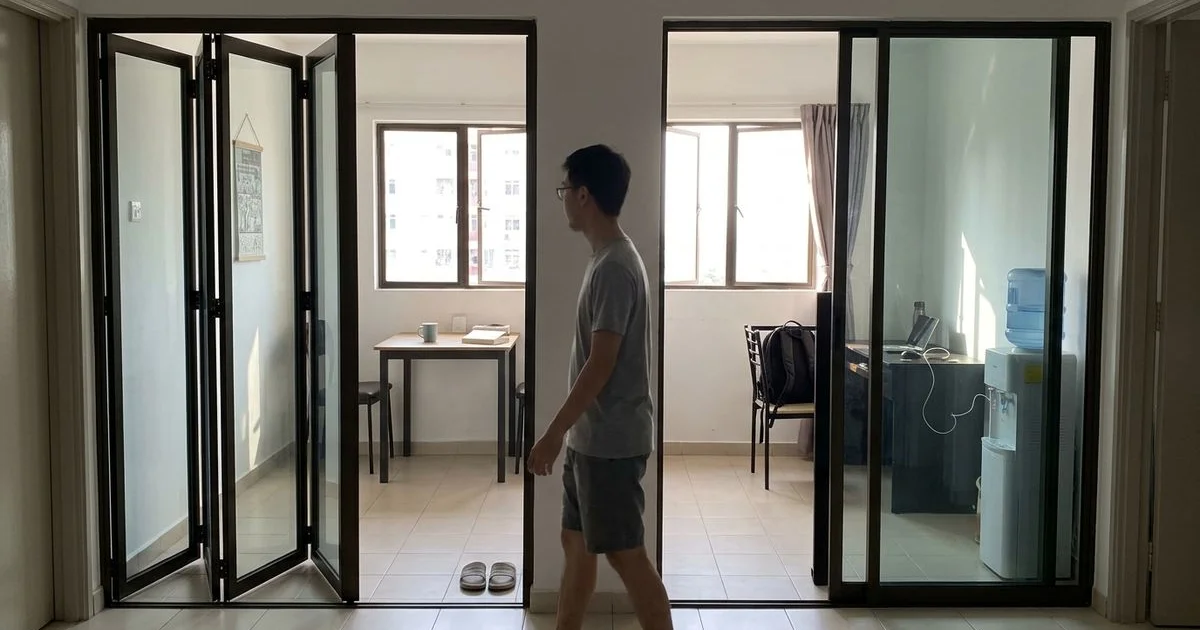 Folding glass door beside a sliding glass door in two compact rooms