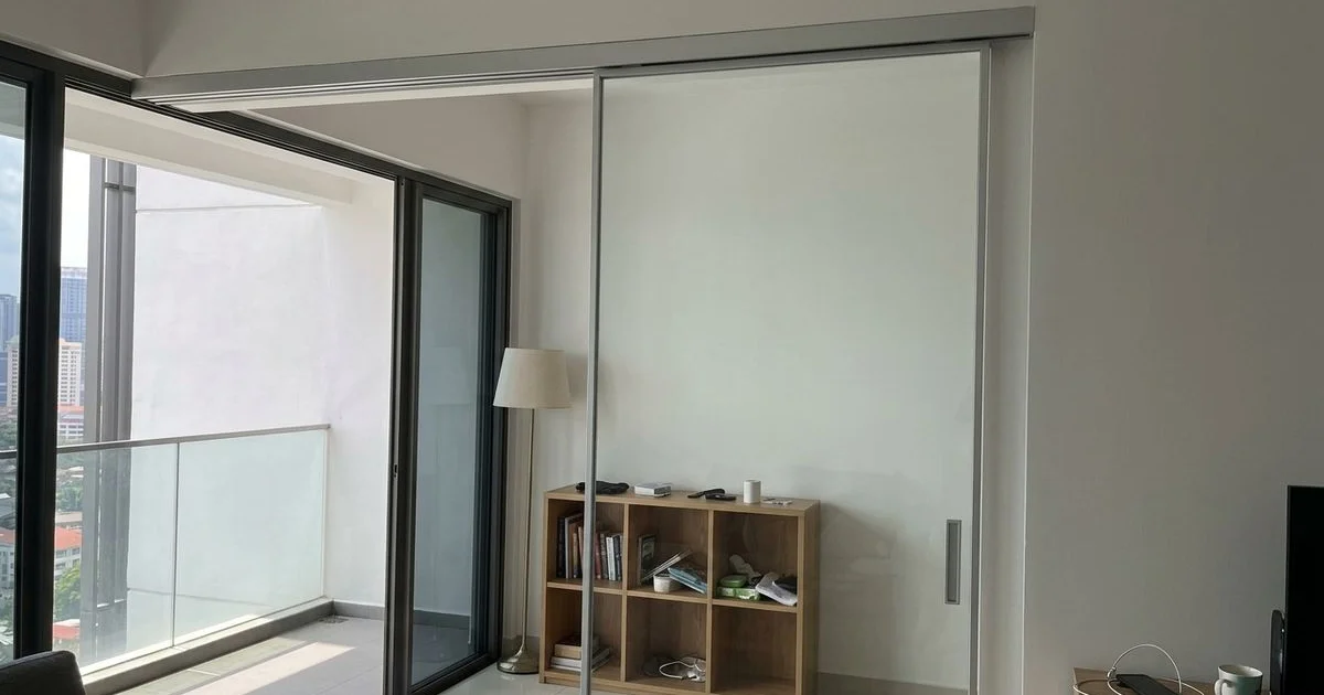 Sleek frameless maglev sliding door in a luxury Malaysian condo