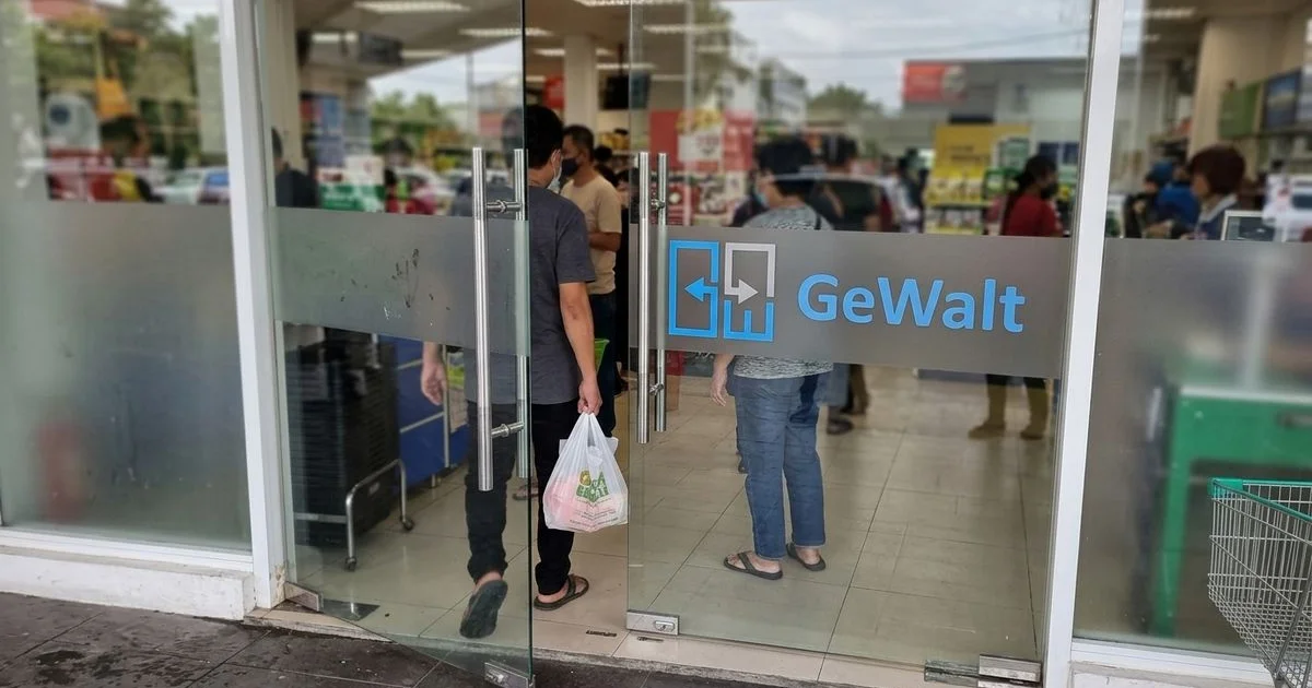 Tempered glass door in a busy Malaysian retail entrance