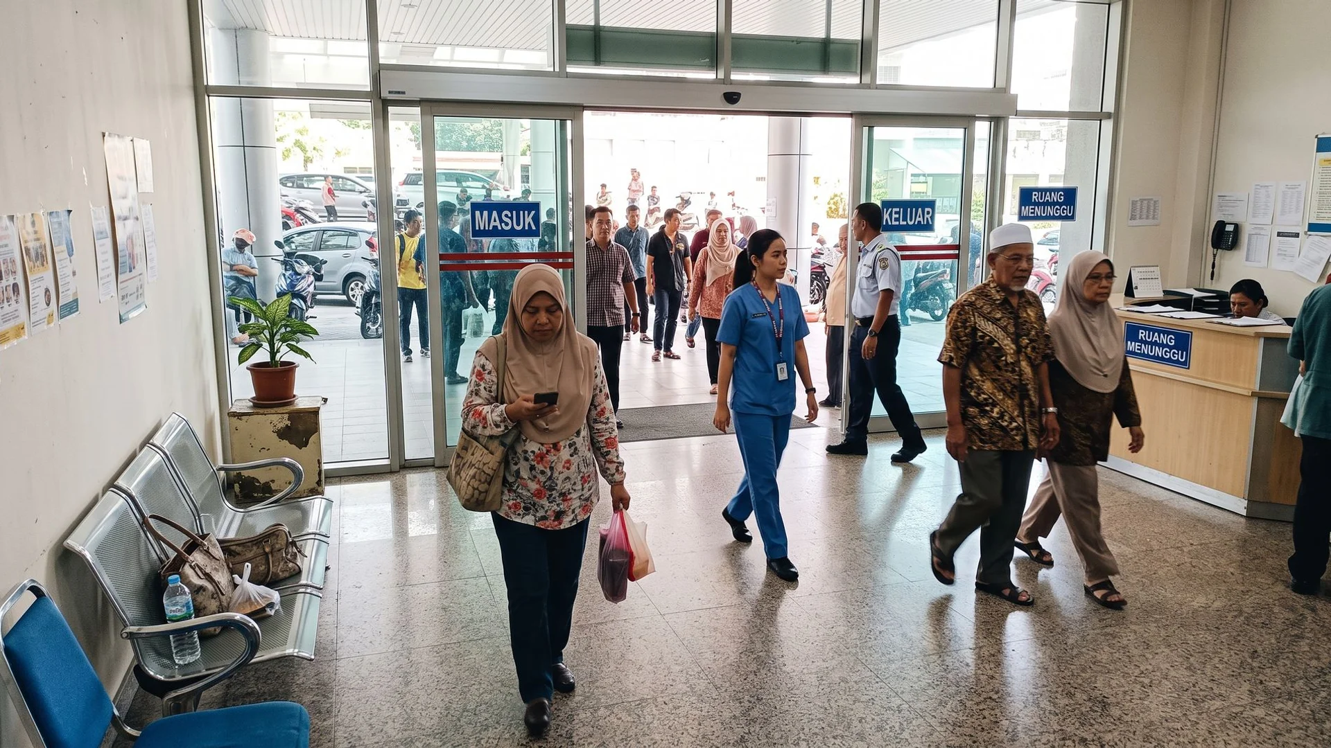 Heavy-duty automatic glass sliding doors at a high-traffic Malaysian building entrance